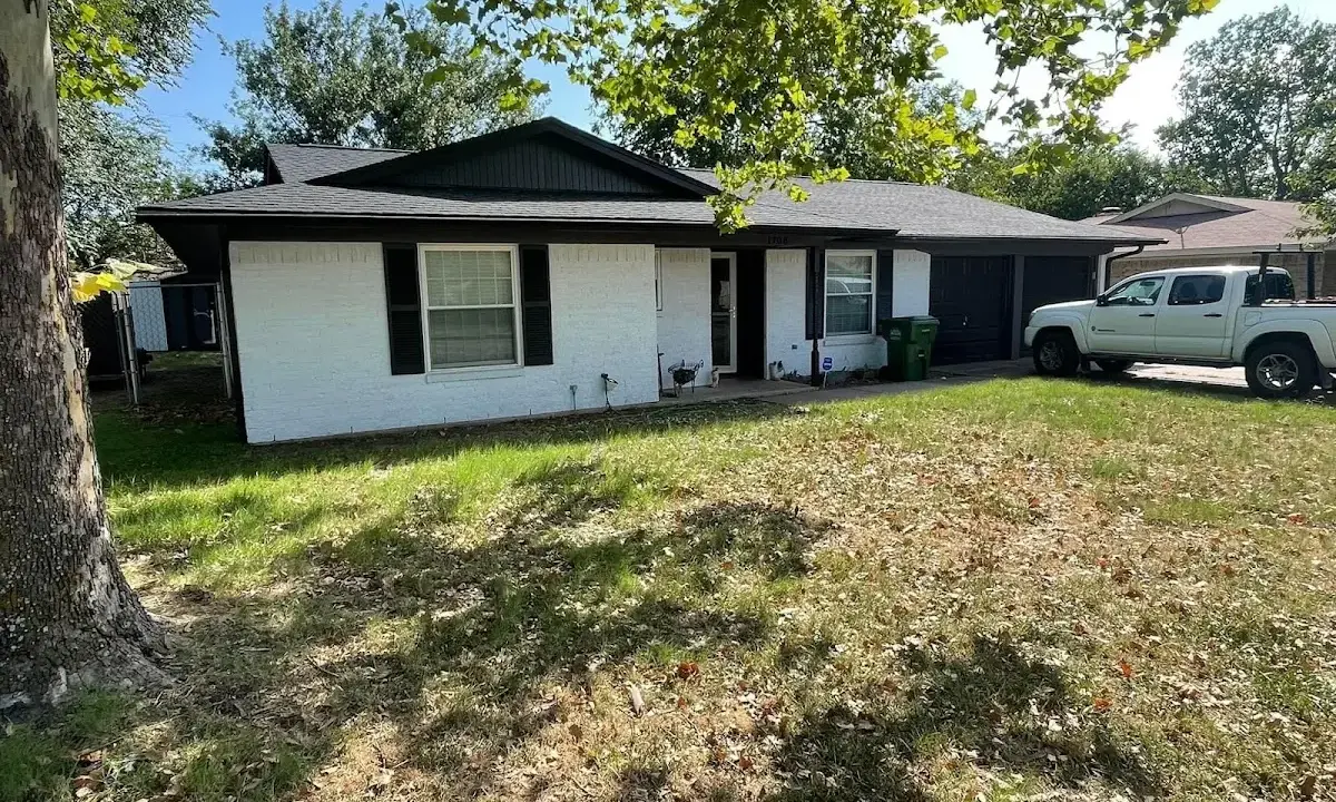 Professional roofing crew working on a residential roof in Monroeville
